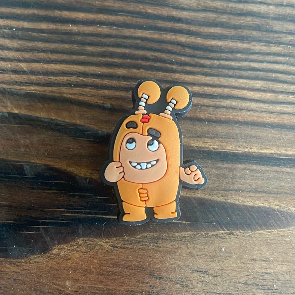 Orange Oddbods Slick crocs shoe charm jibbitz